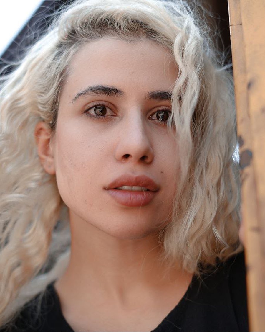 Close-up portrait of Faeze Qasemi outdoors